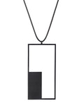 a longer geometric and minimalist rectangular necklace in black powder coated stainless steel from the KONZUK Artus collection