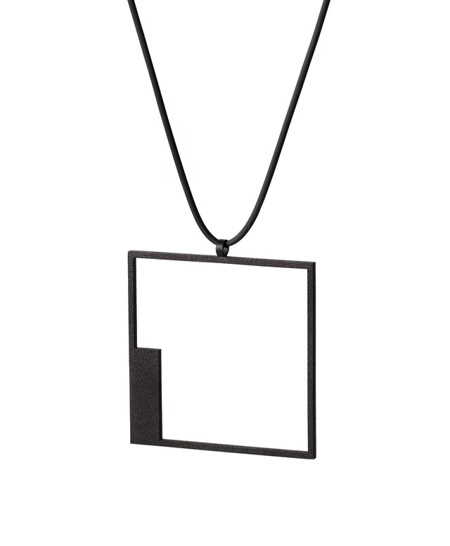 side view of simple and elegant minimalist square pendant in black powder coated stainless steel from the KONZUK Artus collection
