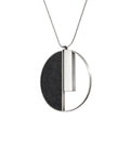 Alt text: "Georg necklaces: Bauhaus-inspired simplicity and geometric elegance in concrete and stainless steel, merging art and technology."