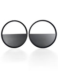 The Sola earrings feature a bold circular form that highlights the depth and tone of cast ash gray resin. Larger in scale, they create a sculptural statement while maintaining a sense of balance and simplicity. The smooth surface holds a quiet luminosity that contrasts beautifully with the dark frame, giving the design a modern yet understated presence.