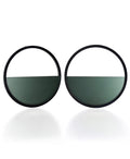 The Sola earrings feature a bold circular form that highlights the depth and tone of cast cypress green resin. Larger in scale, they create a sculptural statement while maintaining a sense of balance and simplicity. The smooth surface holds a quiet luminosity that contrasts beautifully with the dark frame, giving the design a modern yet understated presence.