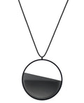 The Vestra necklace in Ash grey embodies balance and quiet strength. Its name, derived from the Latin vestra, meaning “yours,” speaks to a personal connection between wearer and form. Within the circular frame, concrete is cast into resin revealing a smooth plane of depth and tone, reflecting light in a soft, fluid way. The composition feels calm and grounded, offering a sculptural presence that becomes uniquely individual when worn.