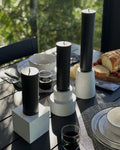 monumental brutalist concrete candle holders with black beeswax pillar candles