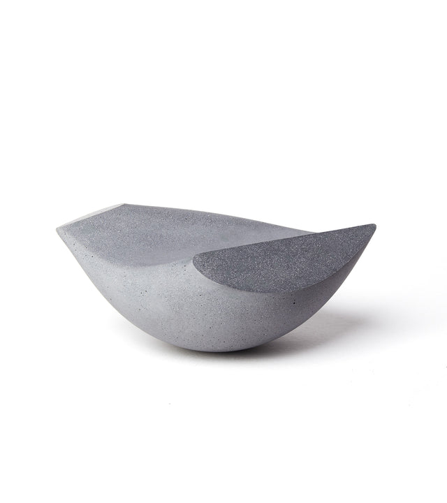 Sideview of small (Bébé) Oiseau bird tabletop sculpture in charcoal concrete.