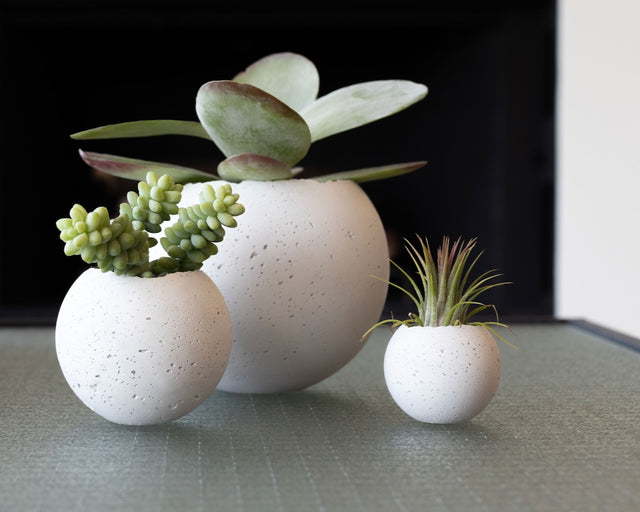 concrete Orbis vessels with raw textured concrete from HouseHold by KONZUK