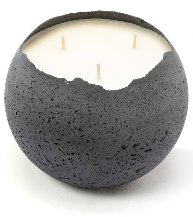 Charcoal grey concrete candle with 3 wicks and floral scent.