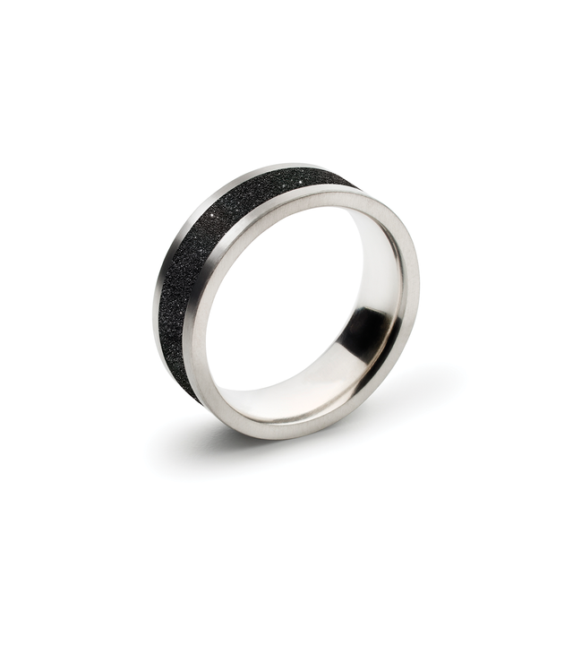 Stainless steel ring with genuine diamond dust embedded into blackened concrete.