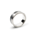 Concrete ring designed to be set off-centered between brushed stainless steel bands in a quarter view profile.