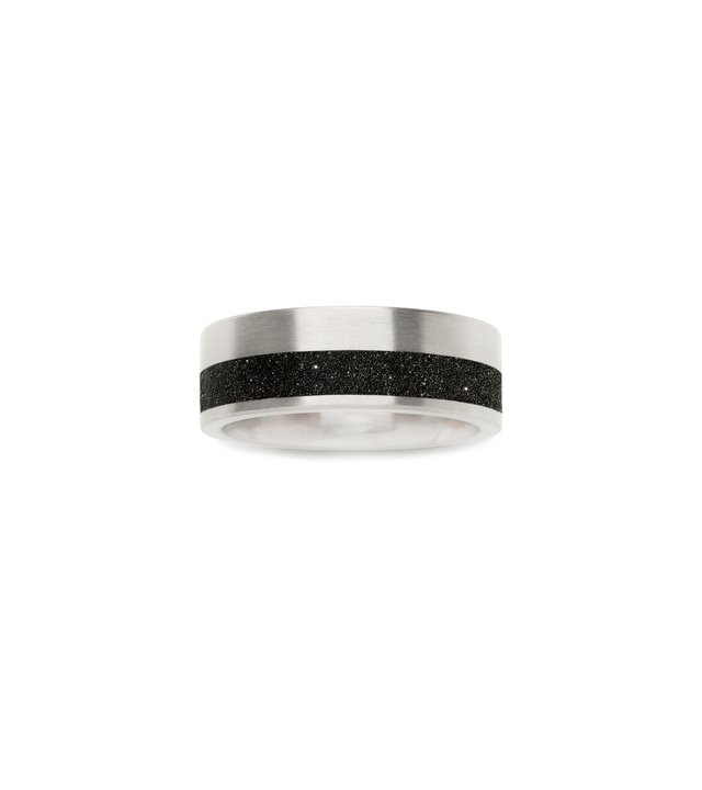 Diamond dust-and-concrete set into channel of stainless steel ring.