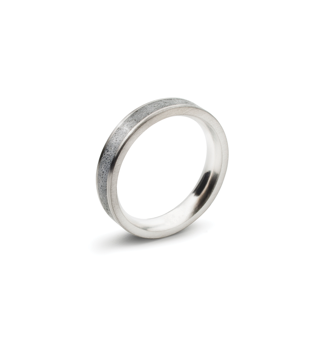 A concrete ring set in between thin stainless steel band. 