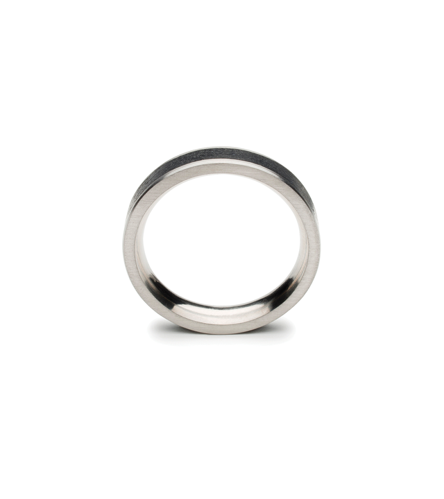 Front view of thin black concrete and stainless ring.