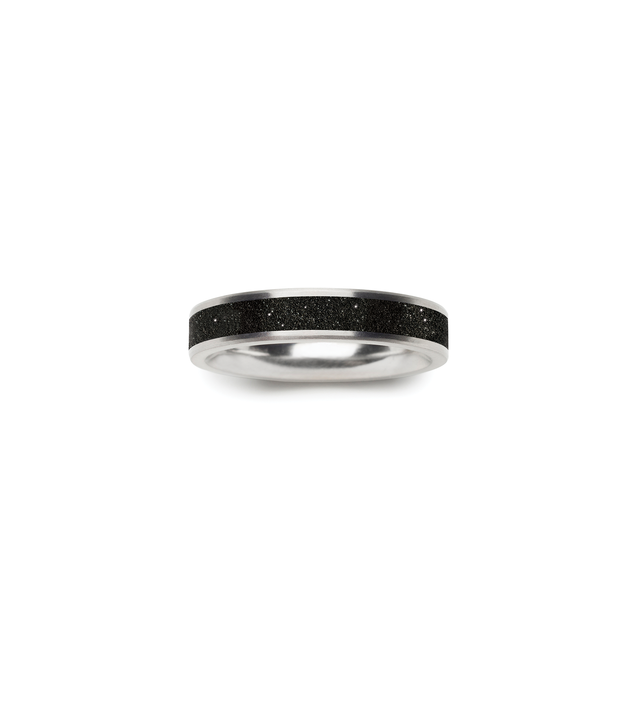 Top view of elegant stainless steel and diamond dust-and-concrete ring.