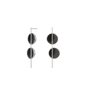 The Arago earrings sparkle with diamond dust infused black concrete set into two asymmetrically placed stainless steel dome connected behind a vertical steel post. 