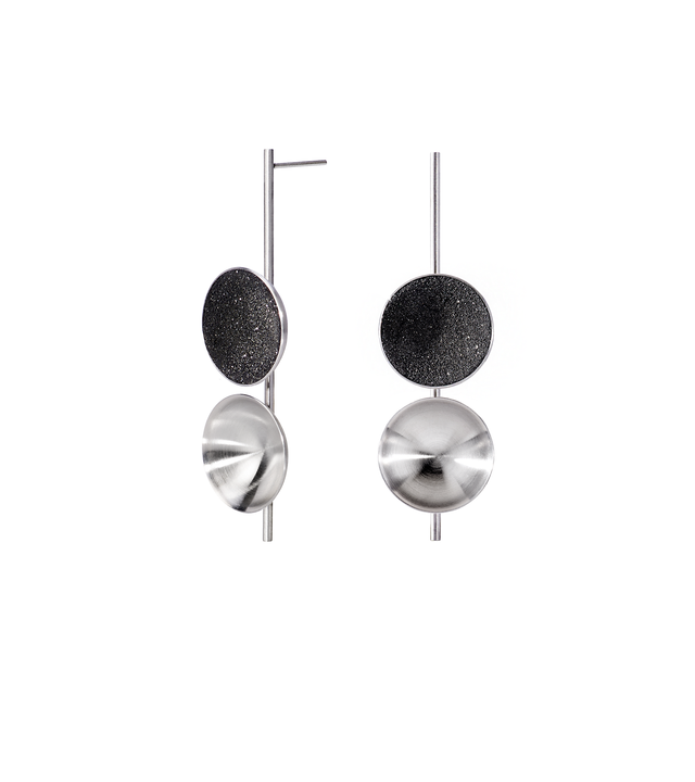 Freya are modern earrings featuring two double stainless steel domes, one lined with diamond dust infused black concrete both architecturally supported an elegant hanging steel post.