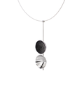 Side view of the Freya statement necklace featuring two double stainless steel larger domes, one lined with diamond dust infused black concrete both architecturally supported an elegant hanging steel post.