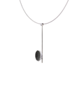 Side view of the Inspira Minor necklace featuring authentic diamond dust embedded into a concrete lined stainless steel dome architecturally positioned onto a suspended minimalist steel post. 
