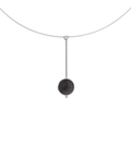 The Inspira Minor necklace feature authentic diamond dust embedded into a concrete lined stainless steel dome architecturally positioned onto a suspended minimalist steel post. 