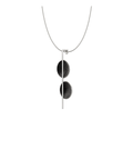 Bauhaus design inspired jewelry featuring black concrete and the sparkle of diamond dust set into two stainless steel domes suspended from a small steel post and necklace cable.