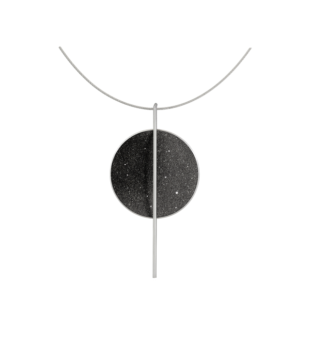The bauhaus inspired Linnea Major necklace sparkles with diamond dust and black concrete set into a stainless steel dome suspended onto an intersecting steel post. 
