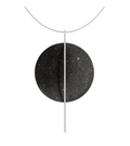 The statement Linnea Max necklace features black concrete and the sparkle of embedded diamond dust set into a large stainless steel dome intersected by a steel post and suspended by a stainless cable.