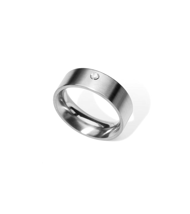 Minimalist stainless steel and diamond engagement ring.