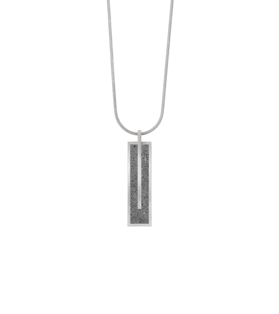 Memento Beholden pendent with concrete set into small rectangular stainless steel design.