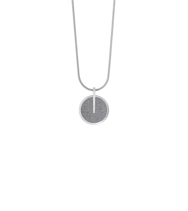 Memento Eternal pendent with concrete set into small circular stainless steel design.