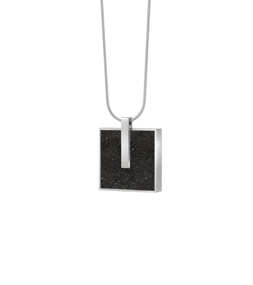 Memento Mindful locket with diamond dust concrete set into square stainless steel design.
