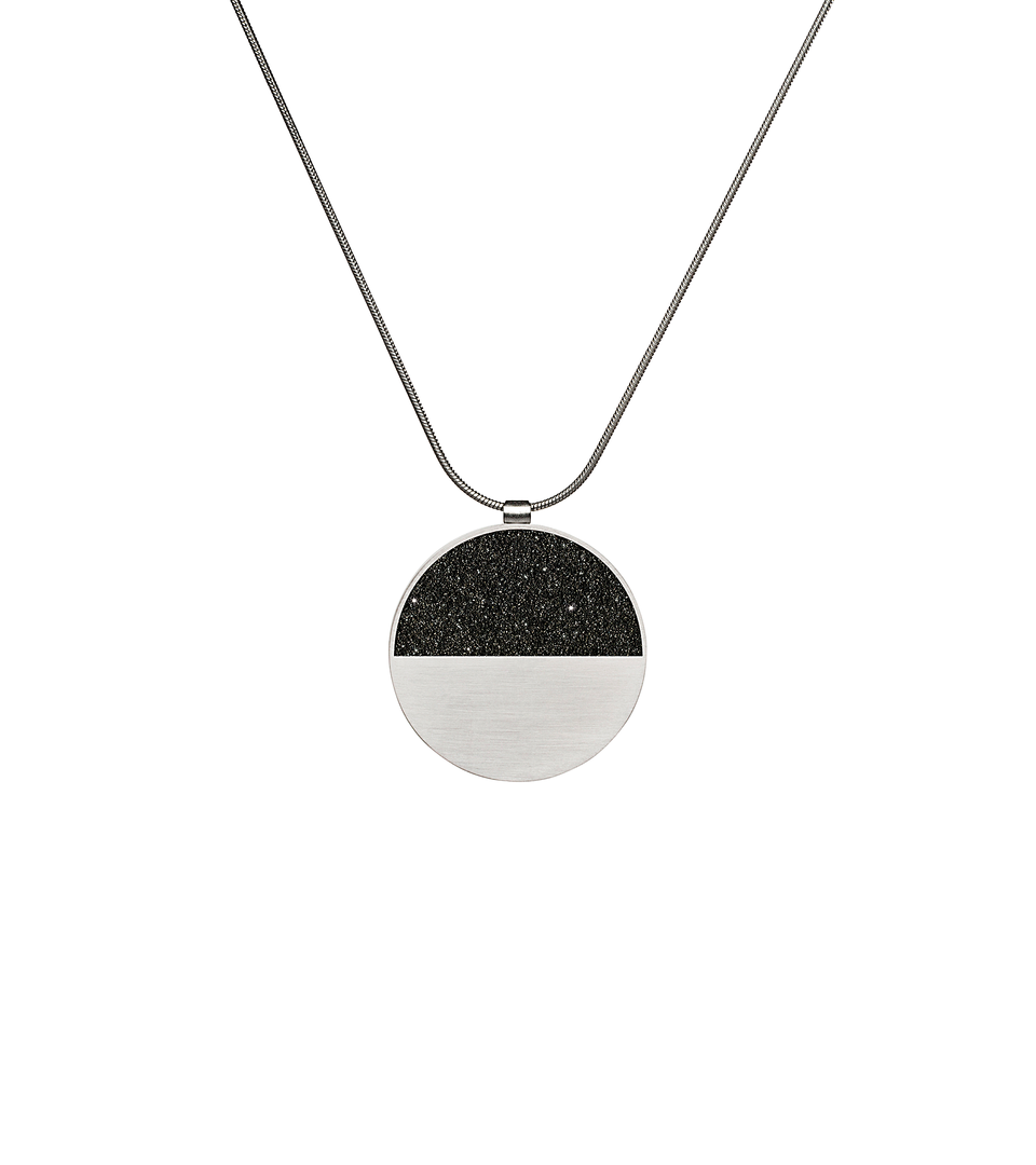Mira concrete and diamond dust necklace achieves minimalist beauty with modernist jewelry design that echoes architectural principles of balance, rhythm and harmony.