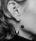 Centauri concrete and stainless steel earrings achieve minimalist beauty with modernist jewelry design that echoes architectural principles of balance, rhythm and harmony.