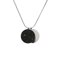 Overlapping double pendant in concrete, diamond dust and stainless steel hangs centred from a simple snake chain. 