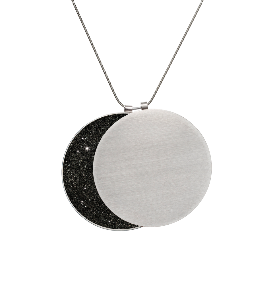 See the phases of the moon in this larger overlapping double pendant in concrete, diamond dust and stainless steel.